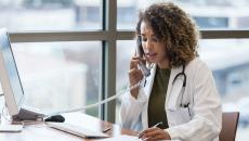 A doctor in a phone call consultation with a patient