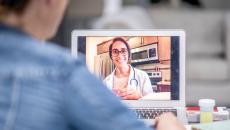 A patient talking to a provider via telehealth
